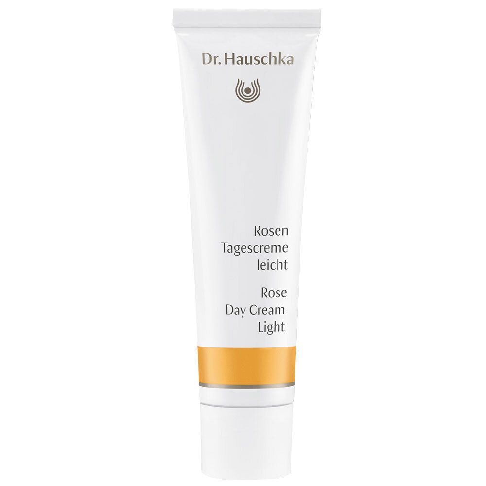 Tube blanche avec texte. Bande orange. Logo Dr. Hauschka. Crème de jour légère à la rose.