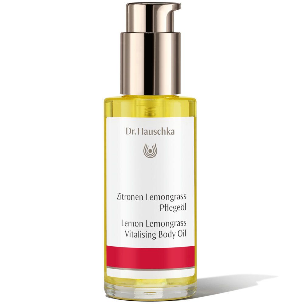 Flacon d'huile Zitronen Lemongrass avec pompe. Étiquette blanche et bande rouge. Logo Dr. Hauschka.