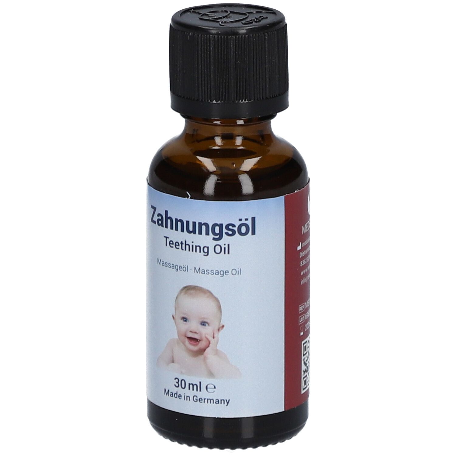 Flacon en verre brun avec bouchon noir. Étiquette avec nom du produit, photo de bébé et texte. 30 ml.