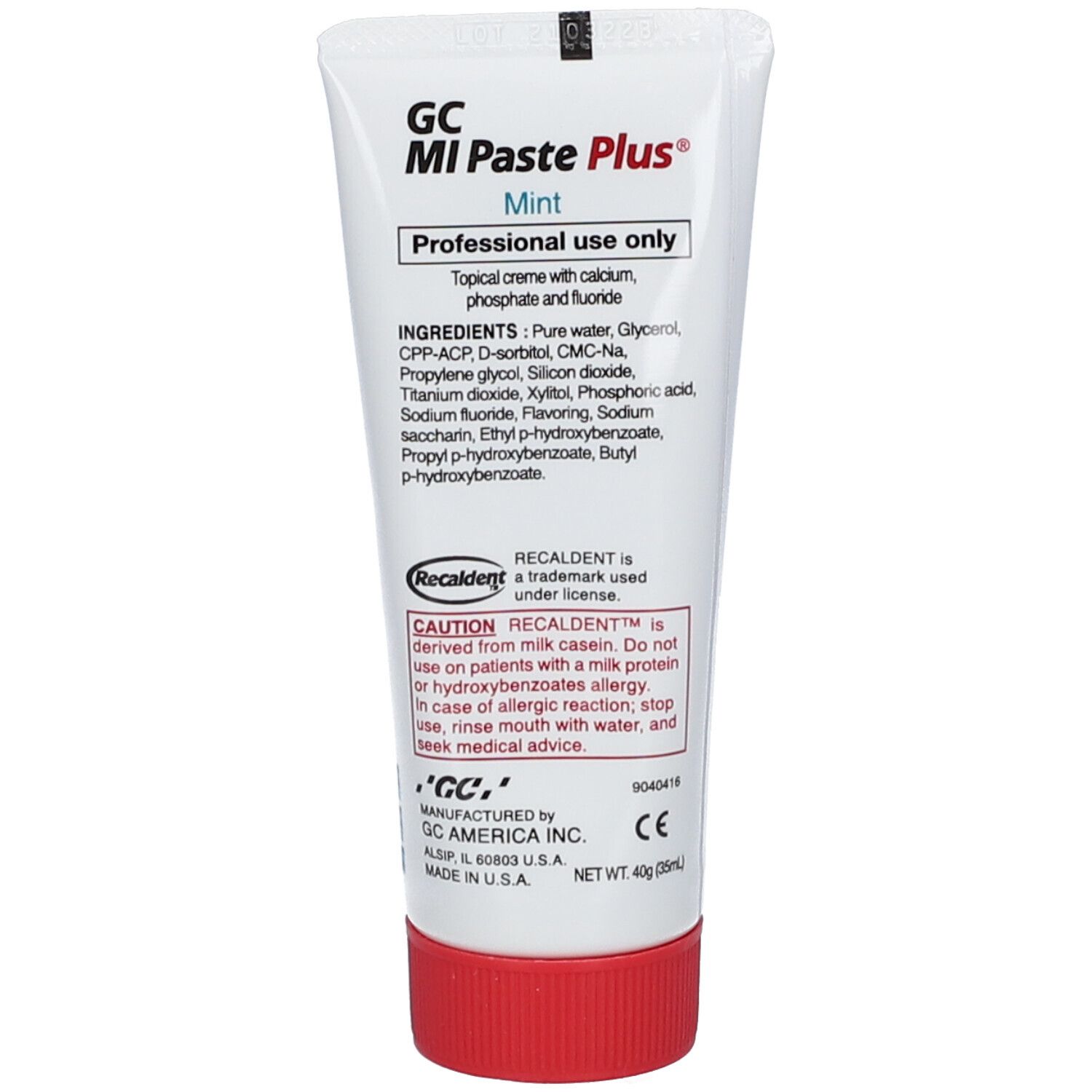 Dos du tube de dentifrice. Contient ingrédients et avertissements. Marque: GC MI Paste Plus® Menthe. Bouchon rouge.