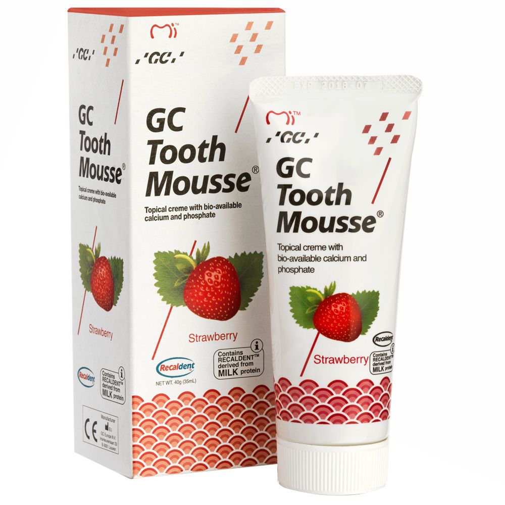 Crème dentaire en tube et boîte. Motif fraise. Contient du calcium et phosphate biodisponibles. Marque: GC Tooth Mousse.