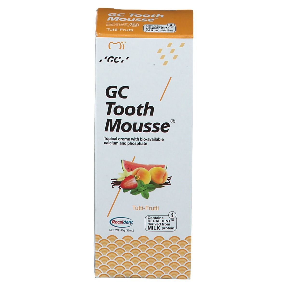 Emballage en carton GC Tooth Mousse Tutti Frutti. Impression avec nom du produit, illustration de fruits et avertissements.