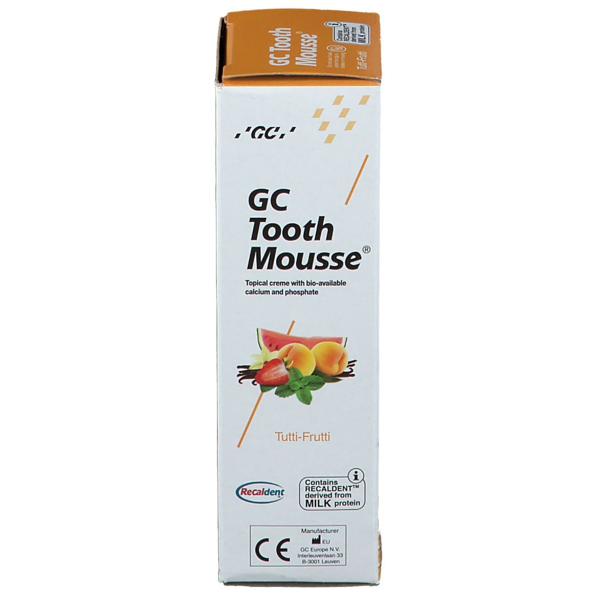 Emballage en carton GC Tooth Mousse Tutti Frutti. Impression avec nom du produit, illustration de fruits et avertissements.