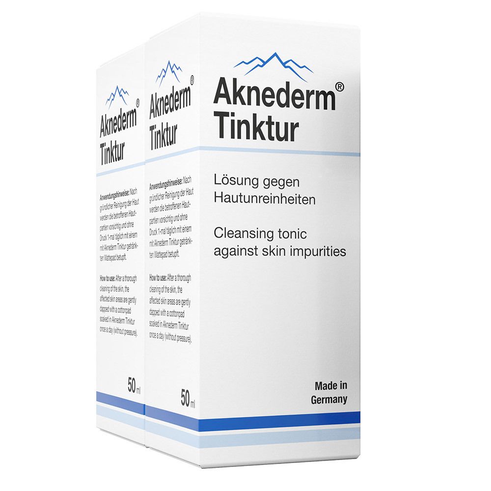 Deux boîtes d'Aknederm Tinktur. Emballage blanc avec nom et texte du produit. 50 ml. Fabriqué en Allemagne.