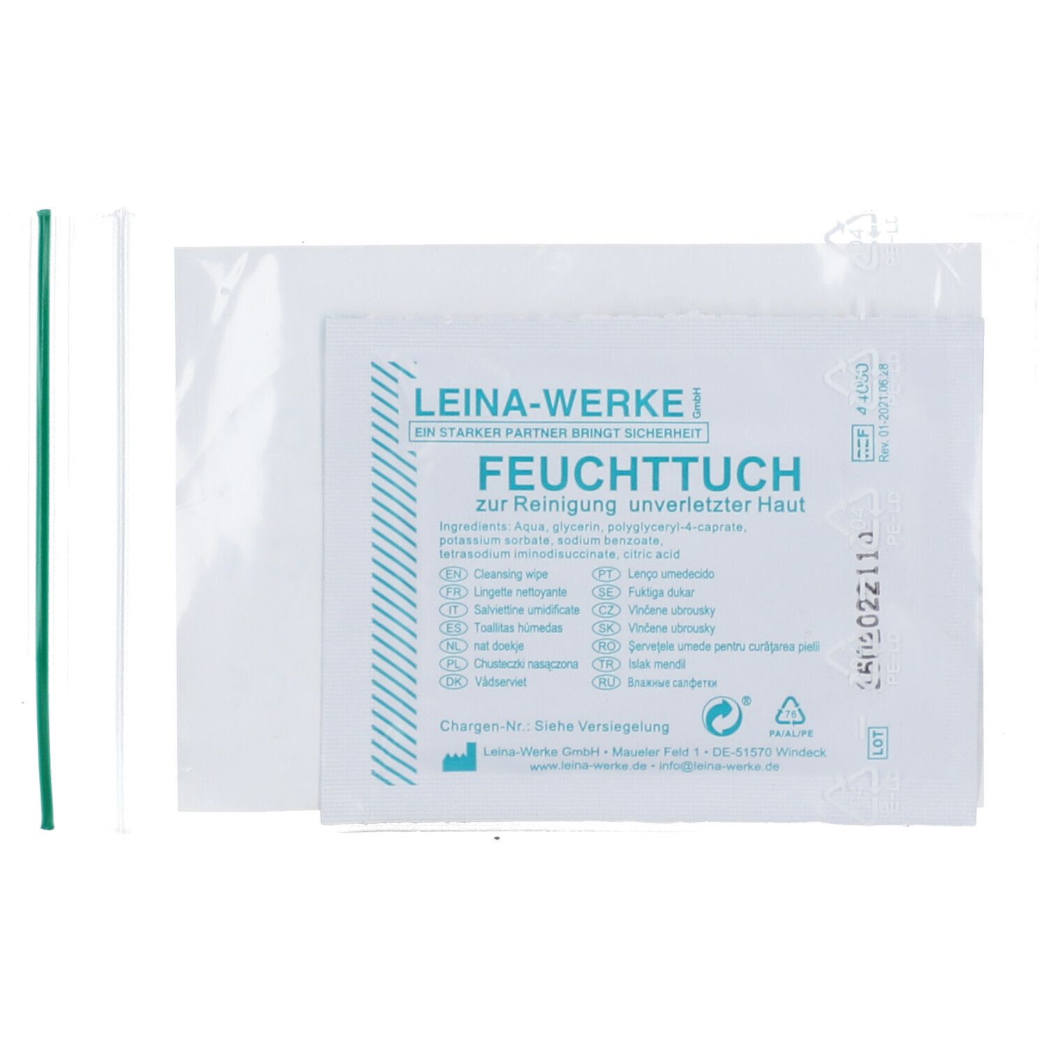 Emballage avec lingette, nom du produit et ingrédients. Bandes vertes et blanches.
