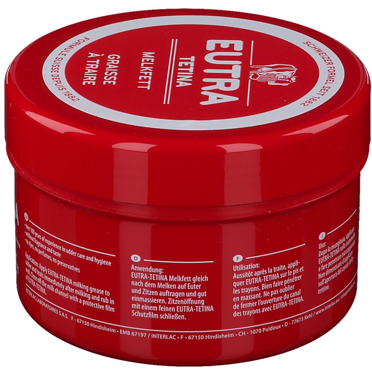 Pot rouge avec couvercle blanc. Inscription: EUTRA TETINA Melkfett, formule suisse. Texte en allemand, français, italien.