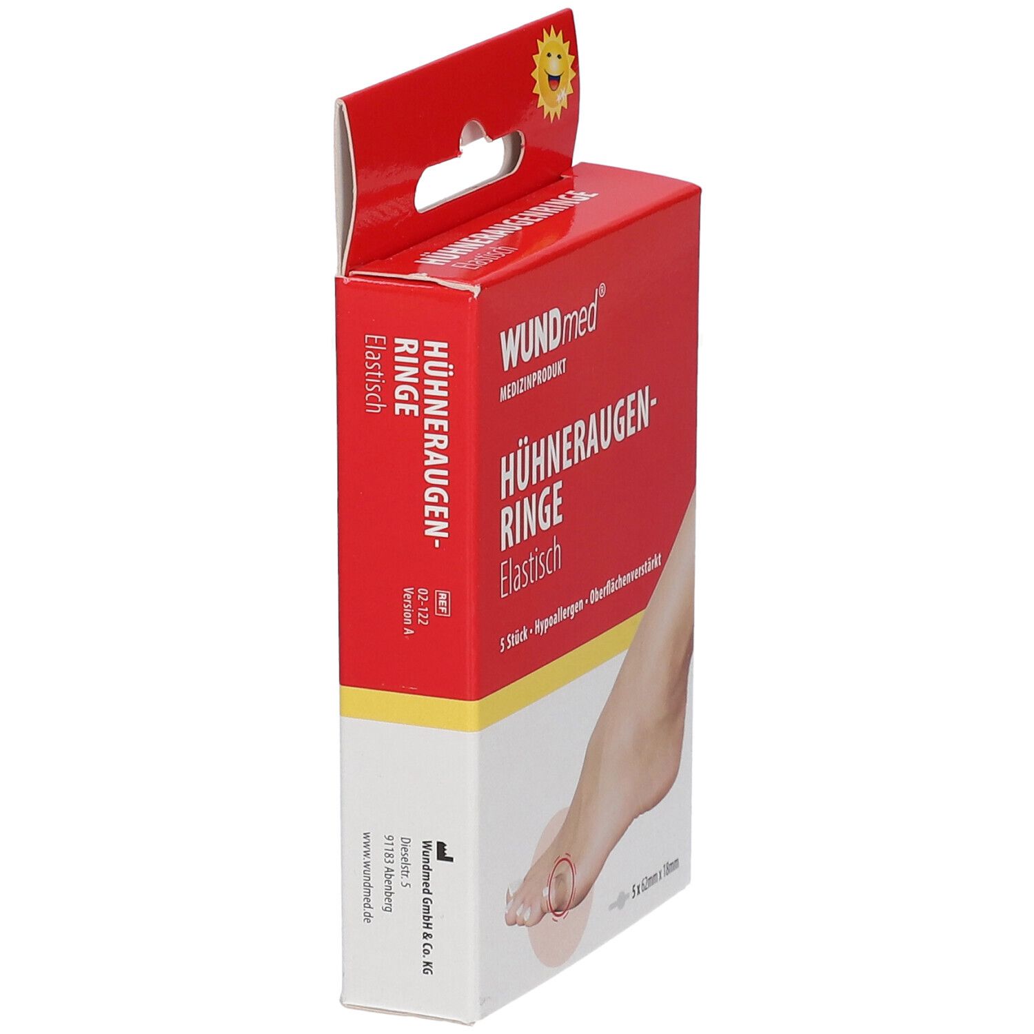 Vue en angle de l'emballage WUNDmed Hühneraugenringe. Boîte rouge avec informations produit et illustration de pied.
