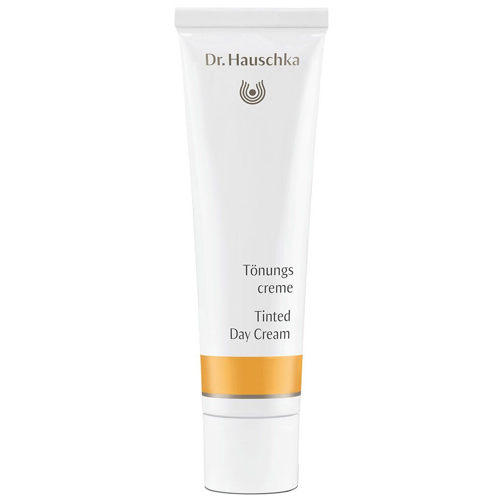 Tube blanc avec bande jaune. Inscription : Dr. Hauschka, Crème de jour teintée.