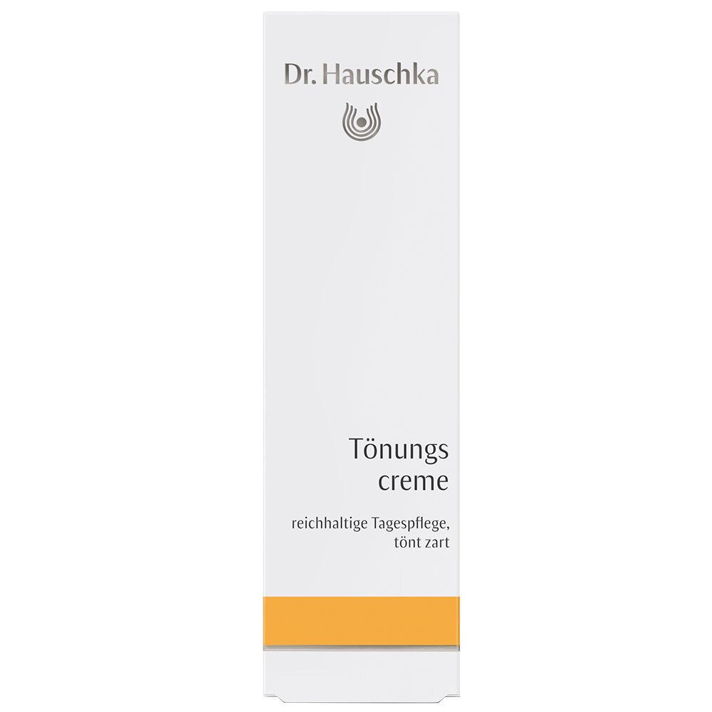 Emballage blanc avec bande jaune. Inscription : Dr. Hauschka, Crème de jour teintée.