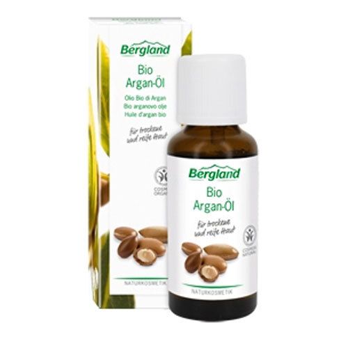 Flacon en verre brun avec bouchon blanc et emballage. Inscription : Bio Argan-Öl. Avec illustration de graines d'argan.