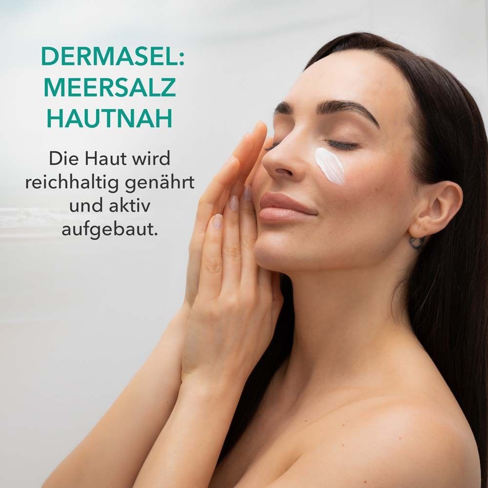 Femme avec crème sur le visage. Texte: DERMASEL: Sel marin au contact de la peau. La peau est nourrie et reconstruite activement.