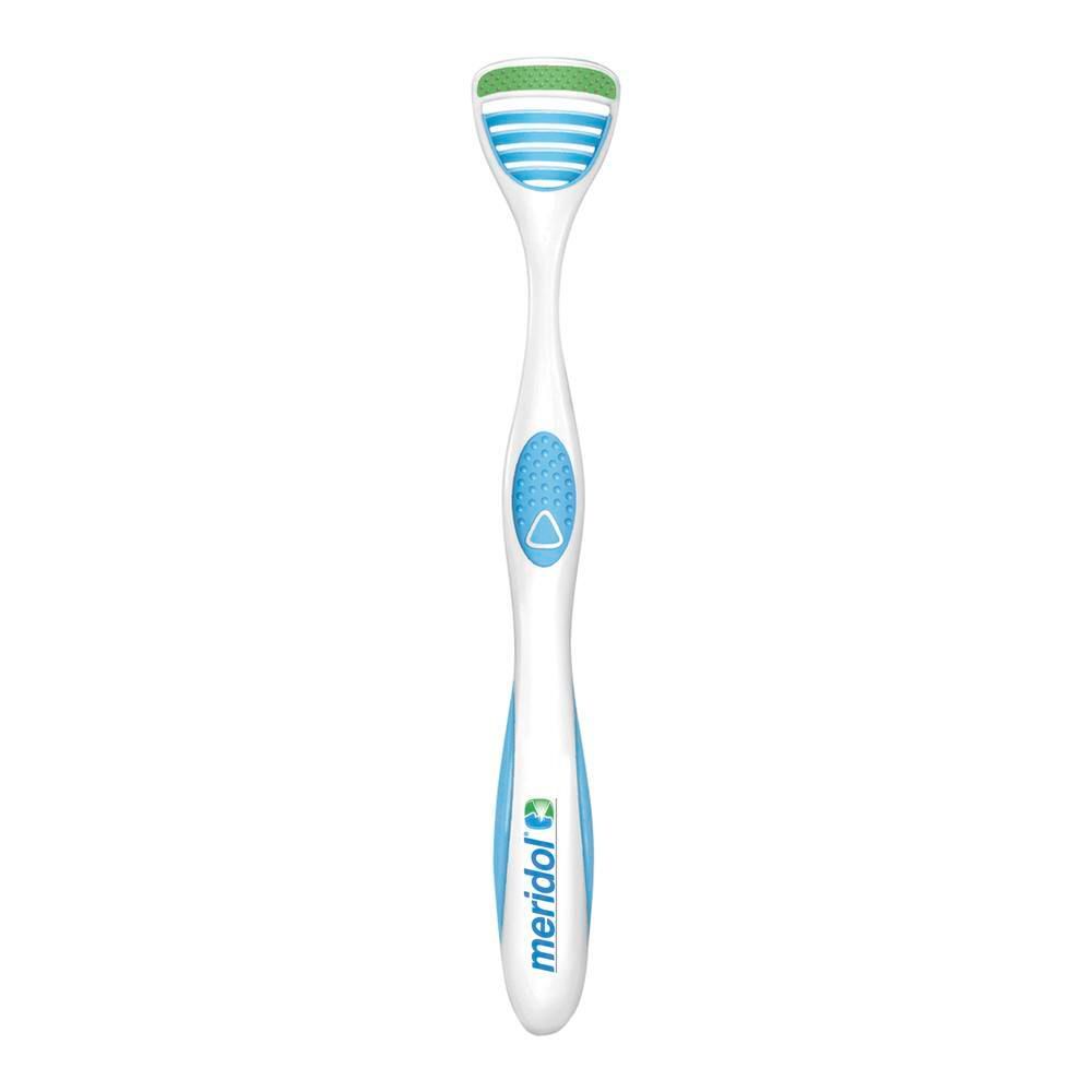 Nettoyeur de langue blanc avec accent bleu et zone de nettoyage verte. Marque meridol.