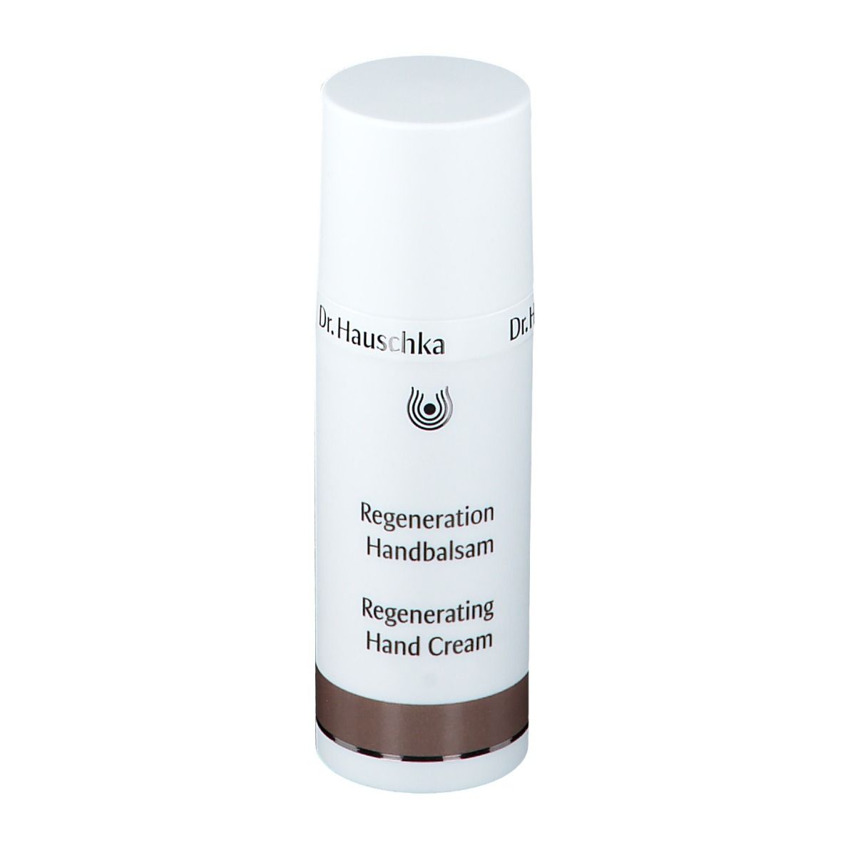 Tube blanche avec bouchon. Inscription: Dr. Hauschka, Regeneration Handbalsam, Regenerating Hand Cream. Bande marron.