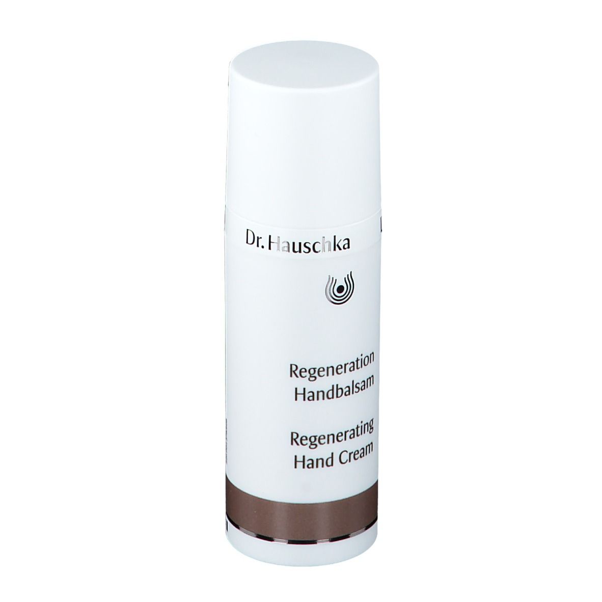 Tube blanc avec bouchon. Inscription: Dr. Hauschka, Regeneration Handbalsam, Regenerating Hand Cream. Bande marron.