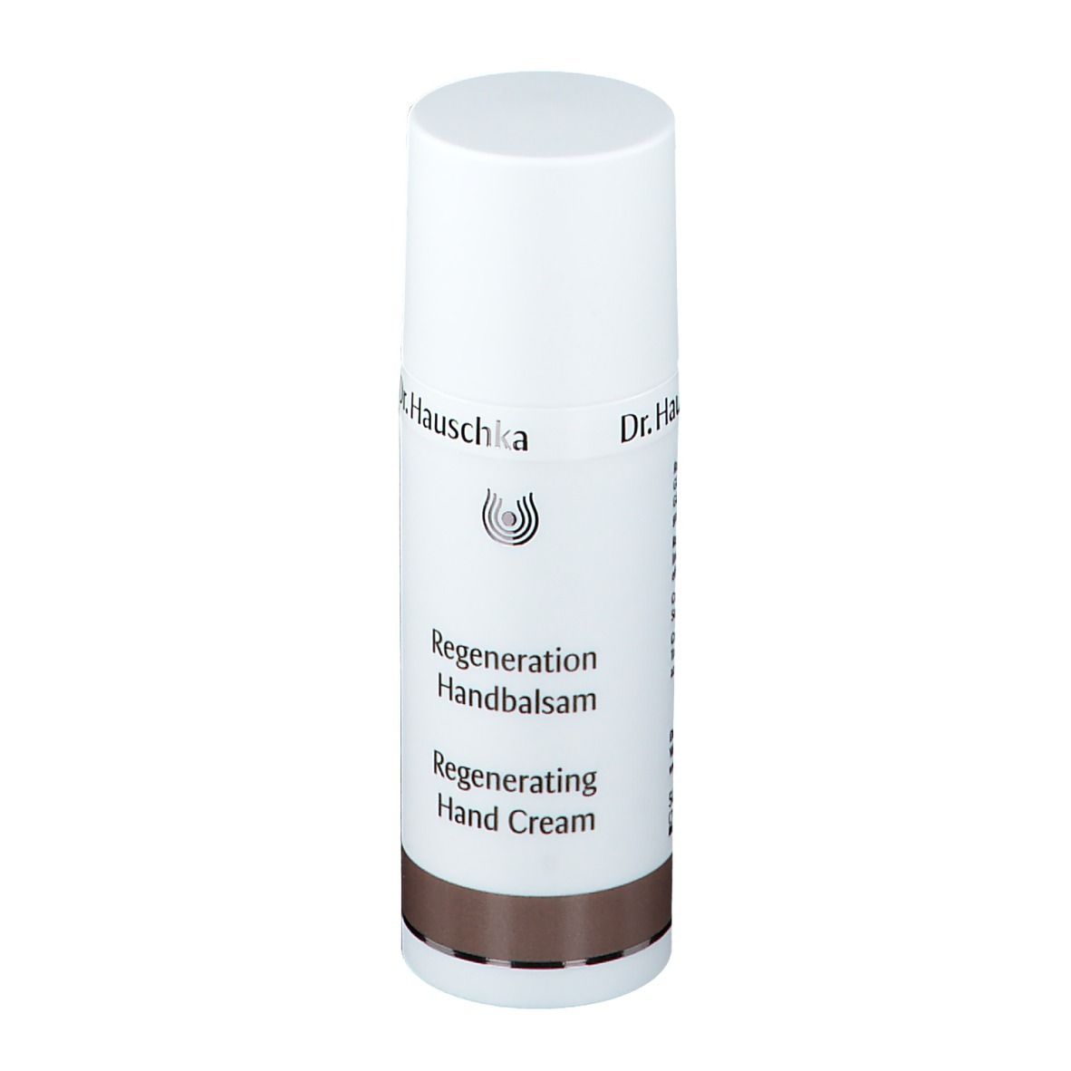 Tube blanc avec bouchon. Inscription: Dr. Hauschka, Regeneration Handbalsam, Regenerating Hand Cream. Bande marron.