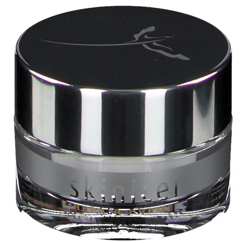 Pot de crème rond avec bord argenté et couvercle noir. Inscription : skinicer.