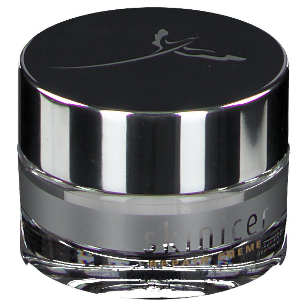 Pot de crème rond avec bord argenté et couvercle noir. Inscription : skinicer.