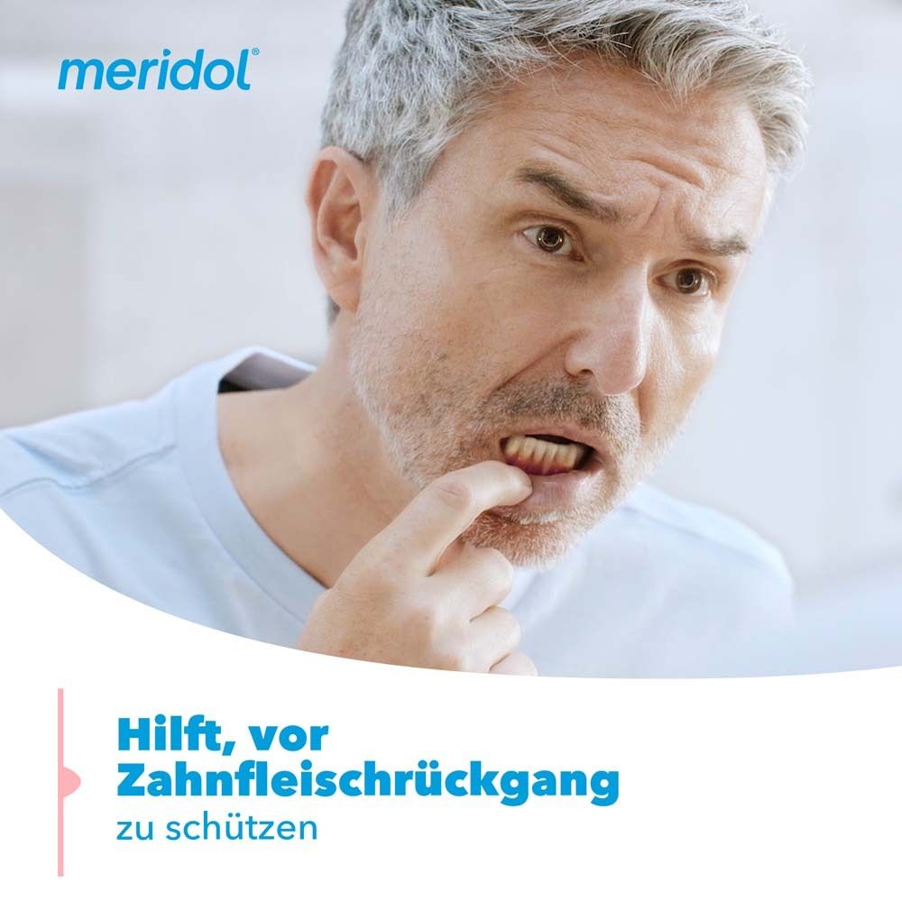 Modèle de dent avec gencives. Le nom meridol est visible.