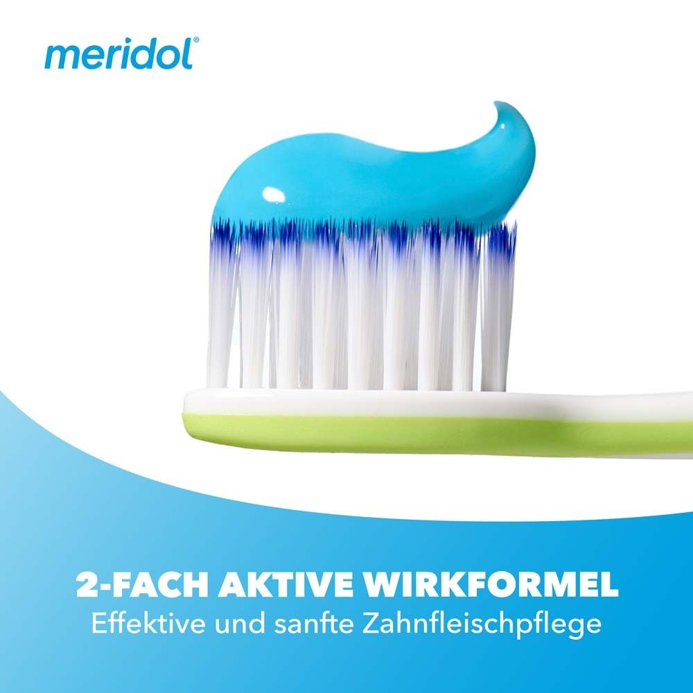 Dos de l'emballage du dentifrice. Informations sur le produit et ingrédients visibles.