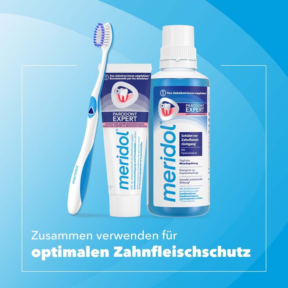 Dos de l'emballage du dentifrice. Informations et illustrations du produit visibles.