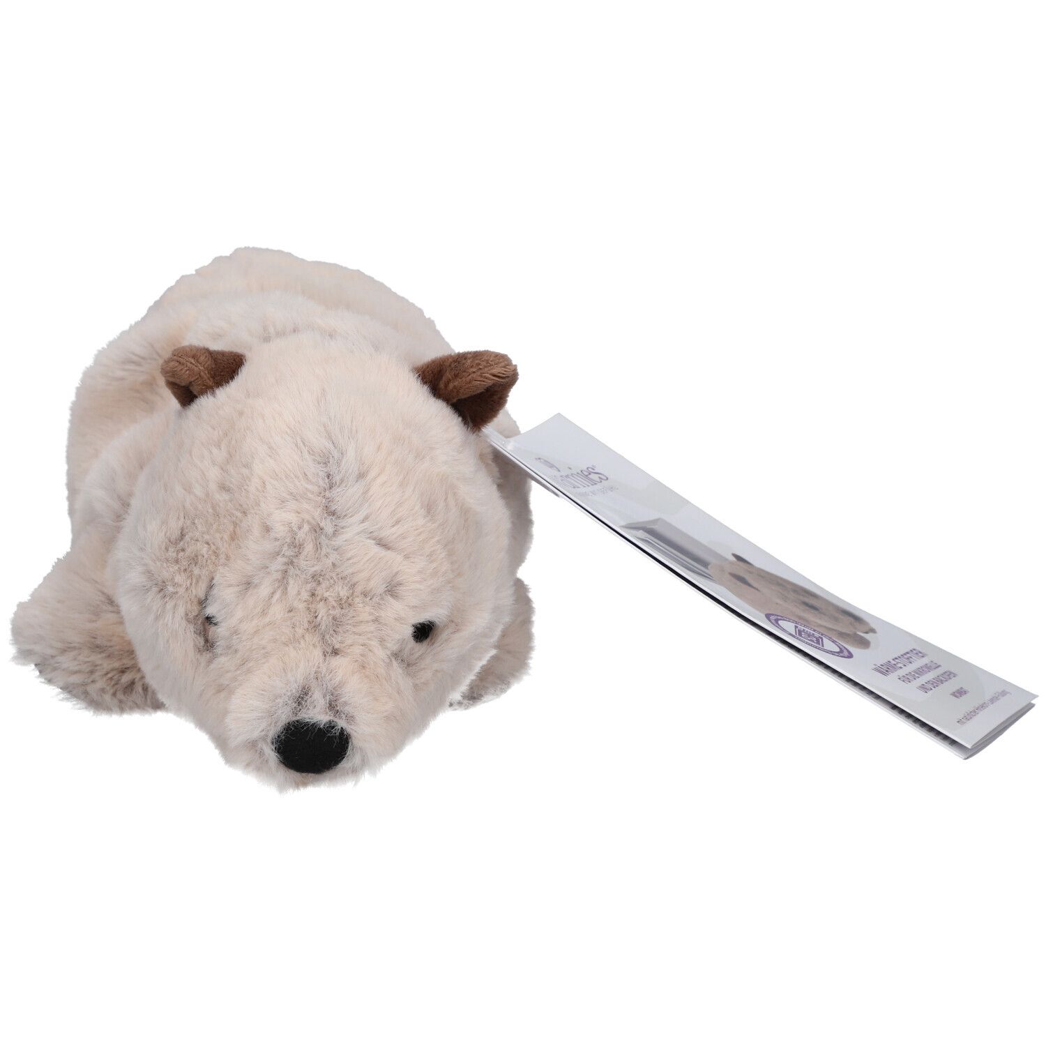Peluche beige en forme de wombat, oreilles marron. Une étiquette est attachée.