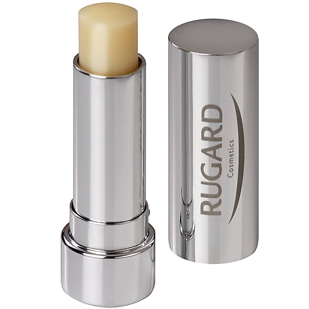 Stick de soin des lèvres avec étui argenté et couvercle ouvert. Le stick est jaune clair et porte l'inscription RUGARD Cosmetics.