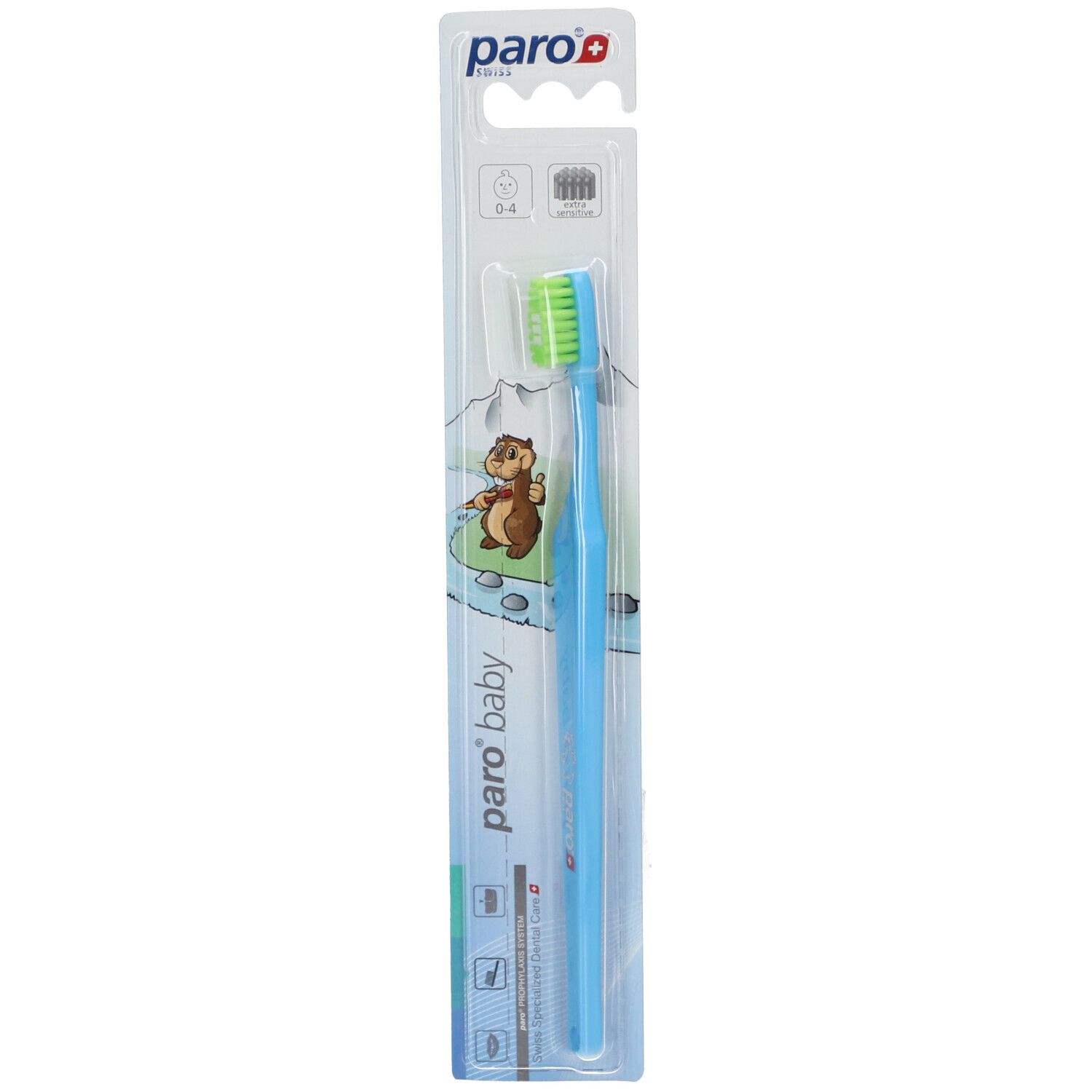 Brosse à dents bleue claire avec tête verte dans son emballage. Marque : paro baby.