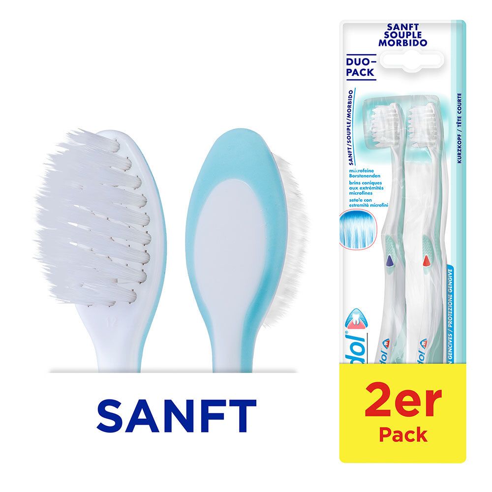 Deux brosses à dents, tête de brosse blanche, manche bleu clair. Emballage Duo-Pack. Inscription : DOUX, lot de 2.