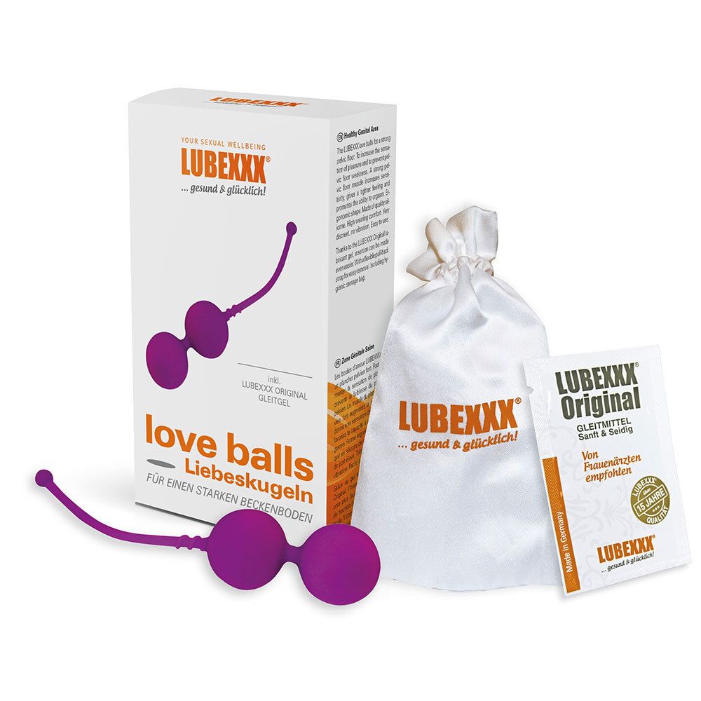 Deux boules violettes avec tige, à côté d'un emballage et d'un sac. L'emballage porte la mention "LUBEXXX" et "Liebeskugeln".