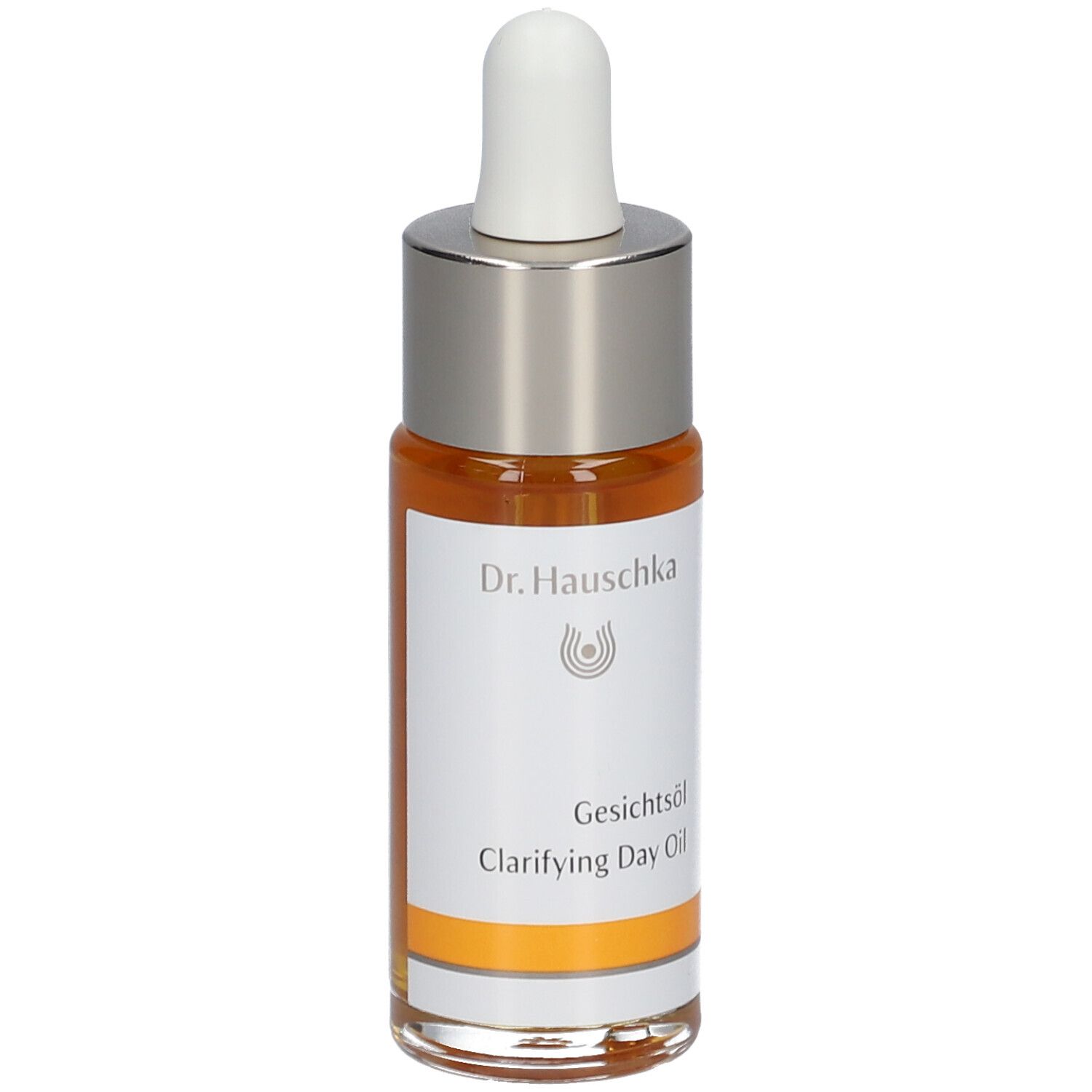 Flacon d'huile pour le visage avec pipette. Huile claire, orangée. Inscription : Dr. Hauschka, Gesichtsöl, Clarifying Day Oil.