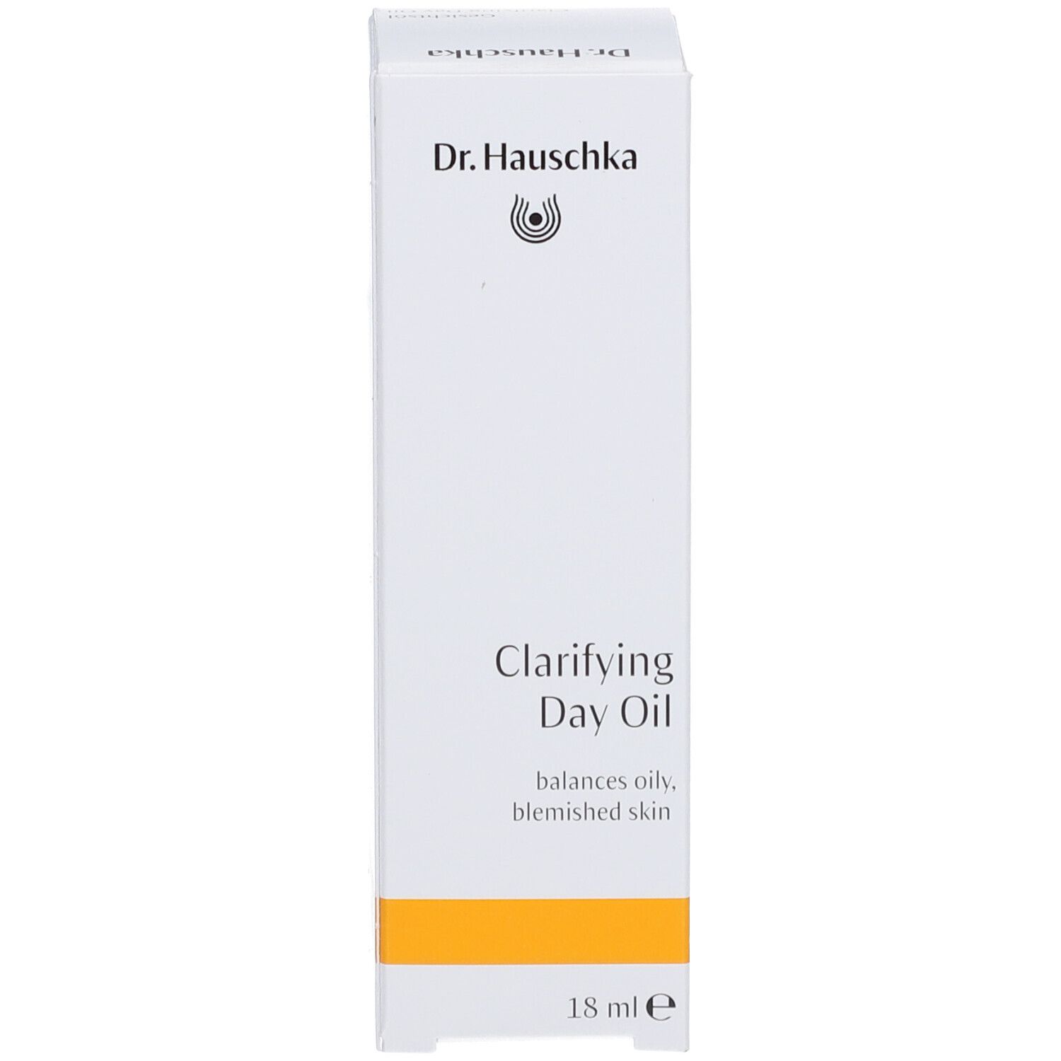 Emballage en carton pour l'huile pour le visage. Inscription : Dr. Hauschka, Clarifying Day Oil, 18 ml.