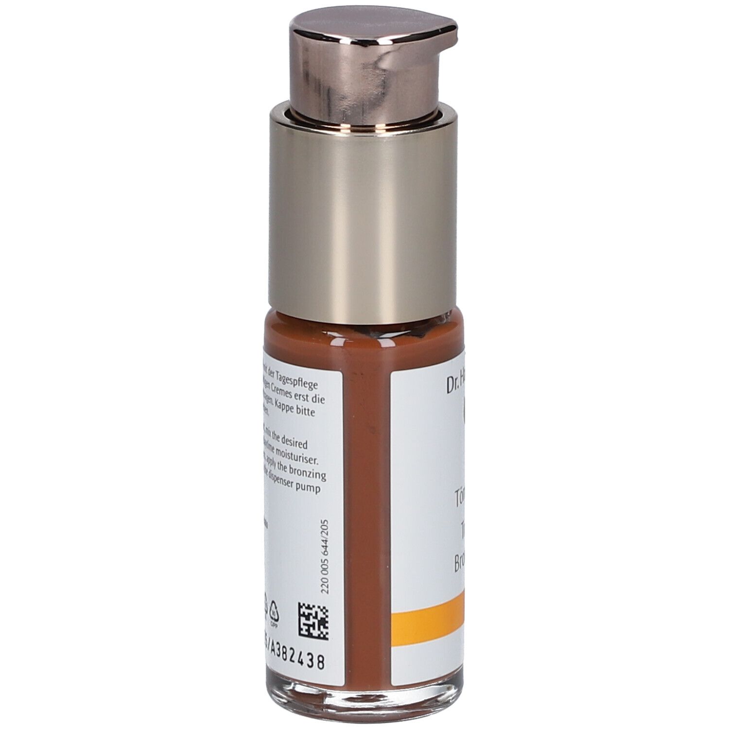 Vue arrière d'un flacon de fluide teinté brun. Inscription : Dr. Hauschka, Tönungsfluid, Translucent Bronzing Tint. Texte et code-barres.