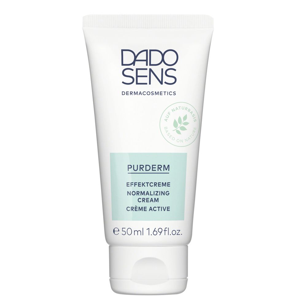 Tube blanche avec logo DADO SENS et nom du produit. Inscription : PurDerm Crème active. Couleurs vert et blanc.