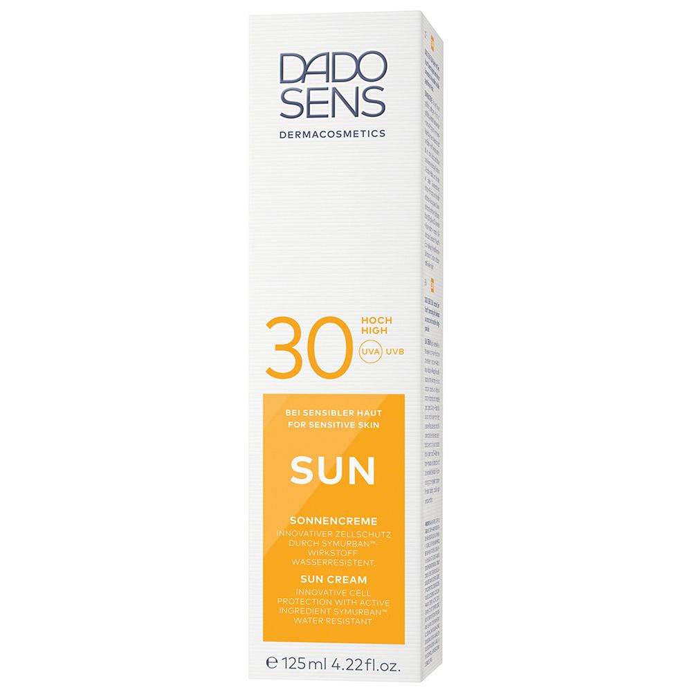 Boîte avec étiquette jaune. Inscription: DADO SENS, SUN, 30, crème solaire. Pour peaux sensibles. 125ml.