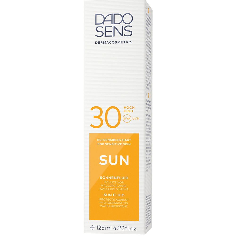 Boîte avec fond blanc et étiquette jaune. Inscription: DADO SENS, 30, SUN, Fluide solaire. Pour peaux sensibles.