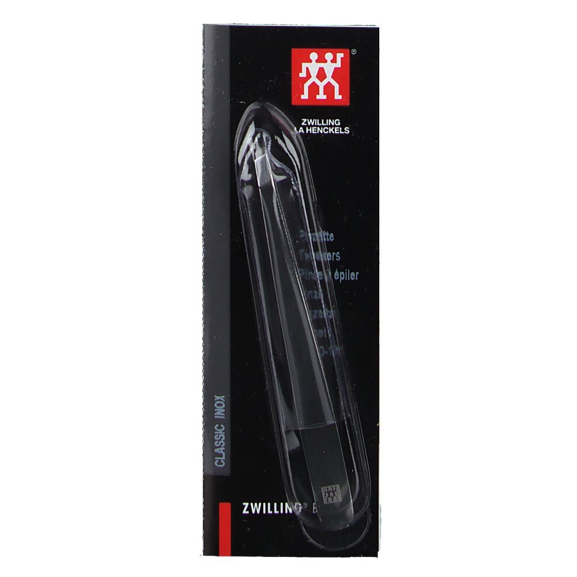 Pince à épiler dans un emballage noir. Visible : logo ZWILLING, nom du produit, forme oblique, acier inoxydable poli.