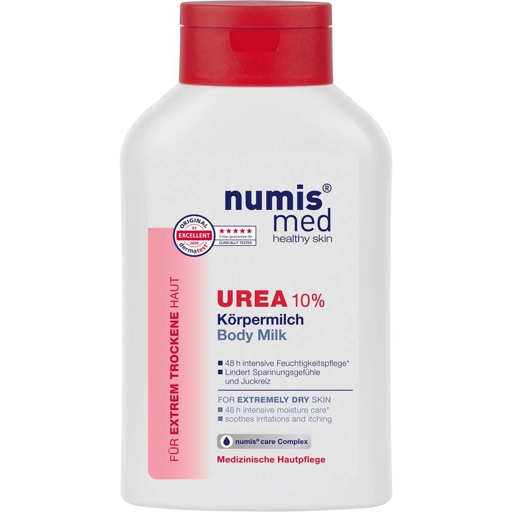 Flacon blanc à bouchon rouge. Inscription : numis med UREA 10% Lait corporel. Testé dermatologiquement.