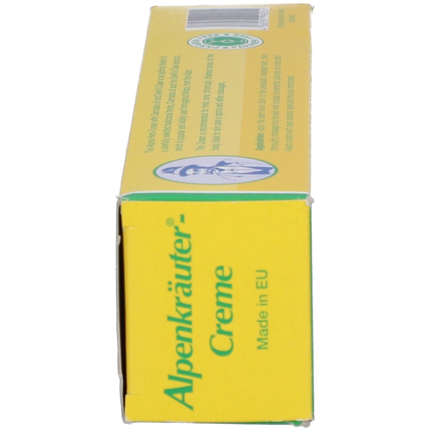 Boîte jaune de crème Alpenkräuter. Inscription : Alpenkräuter-Creme, Made in EU. Bande verte et logo.