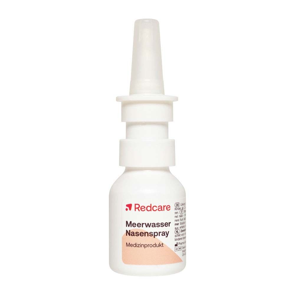 Redcare Meerwasser Nasenspray, flacon blanc avec embout spray. Nom du produit et logo sur l'étiquette.