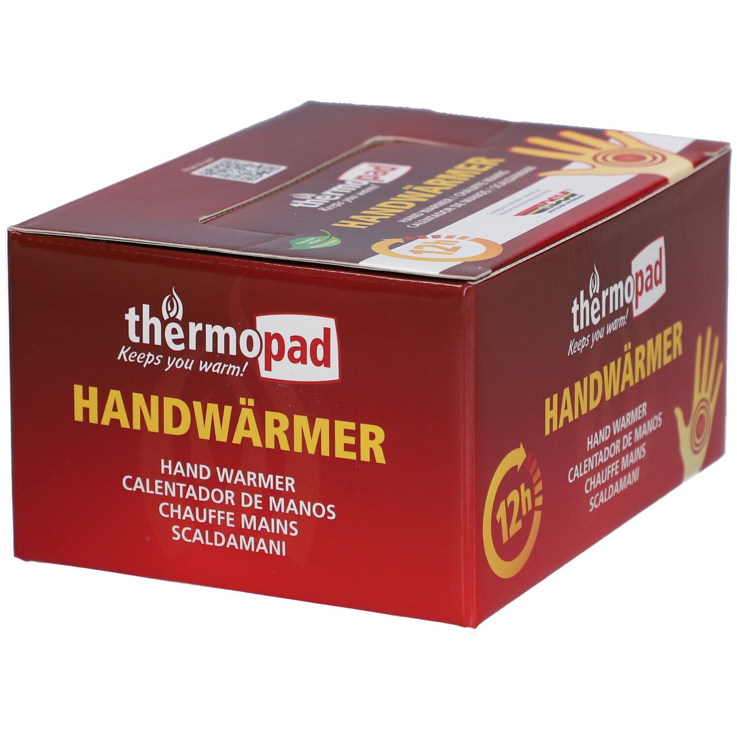 Boîte de thermopad® Handwärmer. Emballage rouge avec nom du produit, illustration de main et symbole 12h.