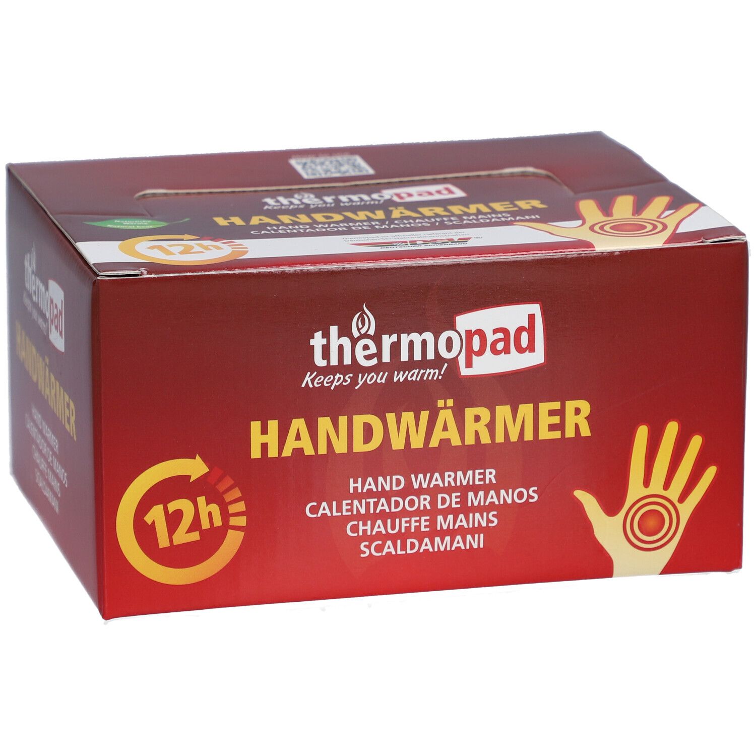 Boîte de thermopad® Handwärmer. Emballage rouge avec nom du produit, illustration de main et symbole 12h.