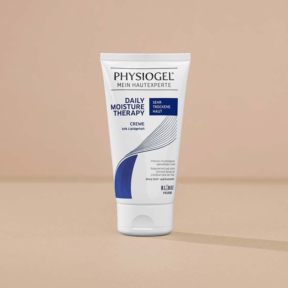 Tube de crème PHYSIOGEL® Daily Moisture Therapy. Blanc, accents bleus. Texte : Peau très sèche, crème 14 % de lipides.