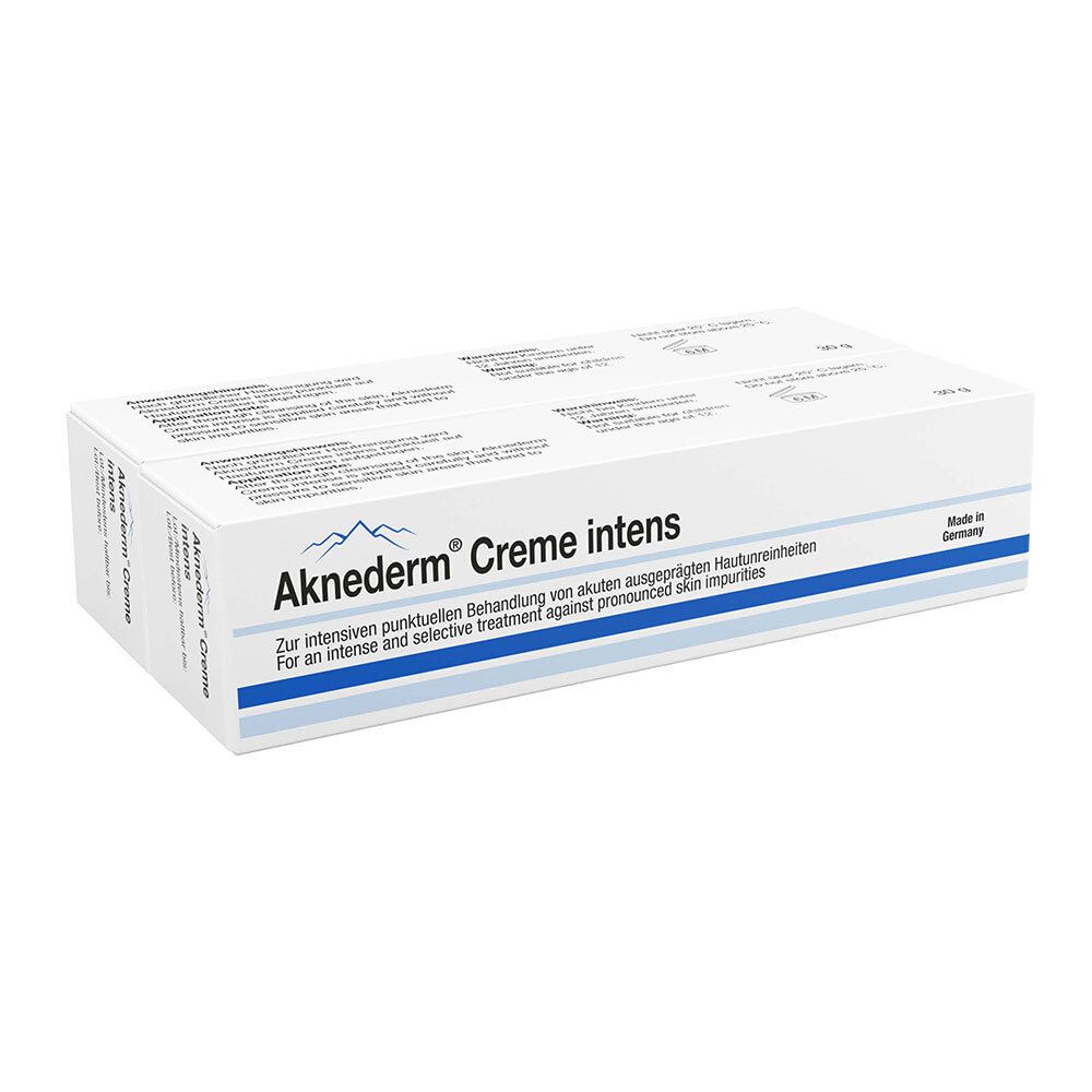 Boîte de Aknederm® Creme intens. Emballage blanc avec texte bleu et logo. Texte en allemand et anglais.