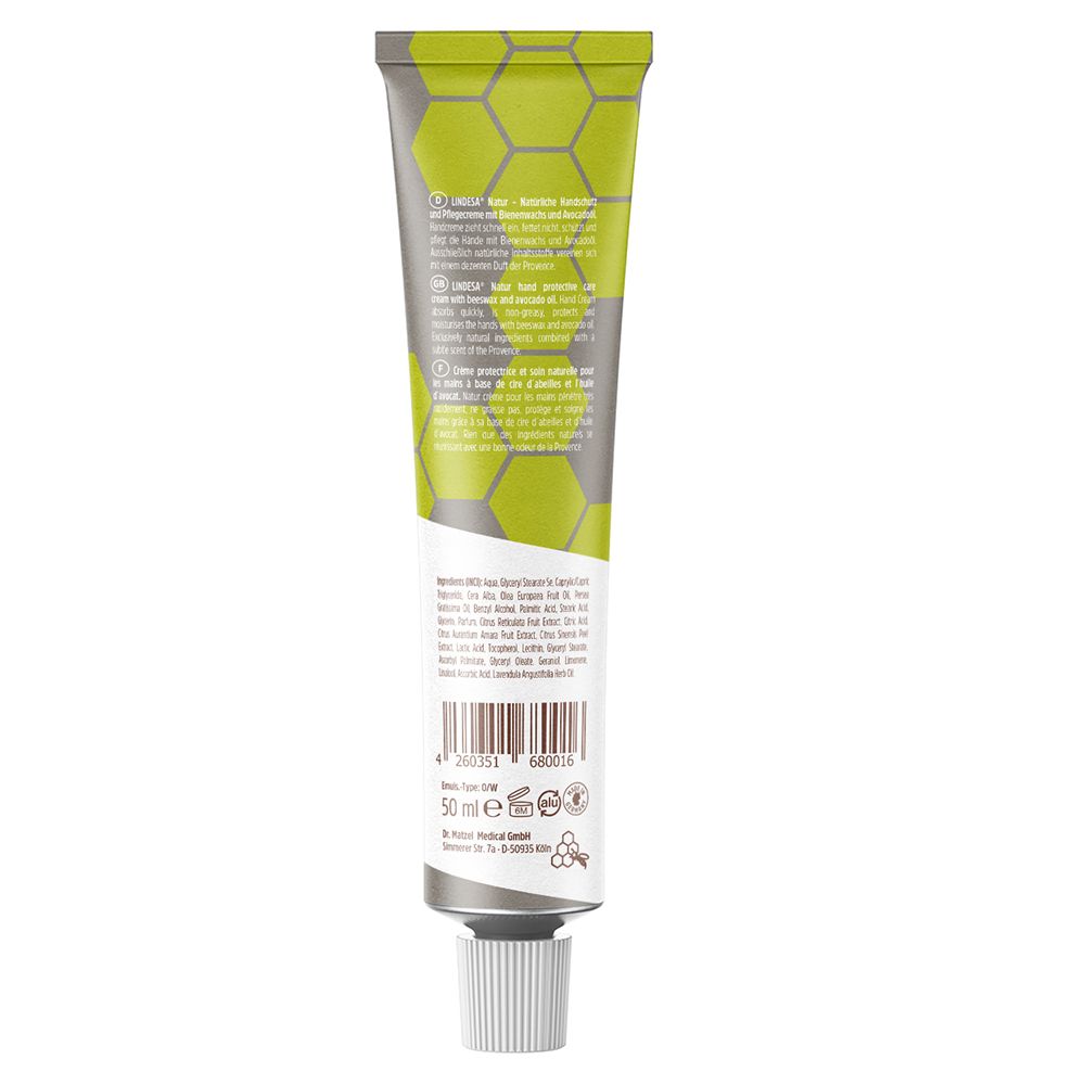 Dos du tube de crème. Texte en plusieurs langues. Inscription : 50 ml. Logo : Testé dermatologiquement. Fond vert avec motif en nid d'abeilles.