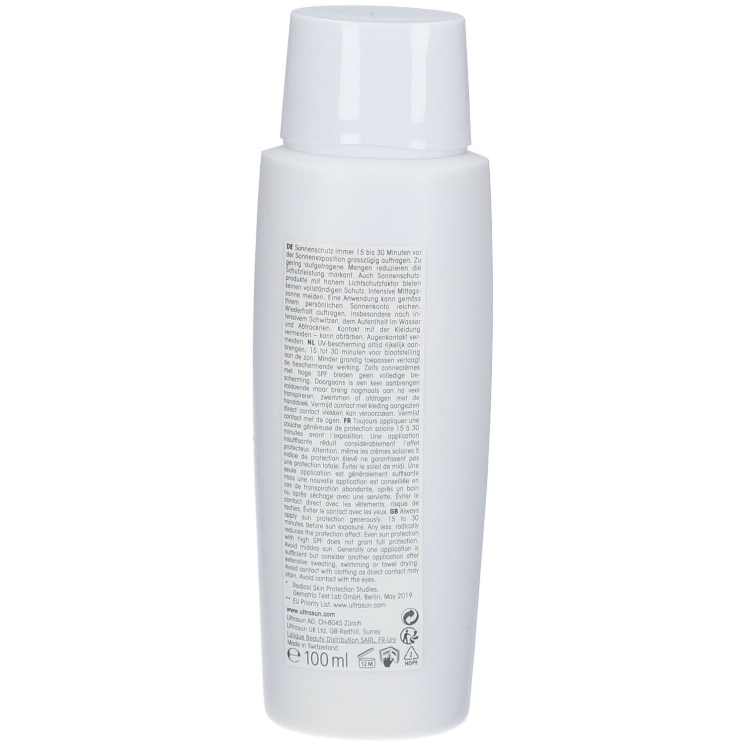 Dos d'un flacon blanc. Texte multilingue. Inscription : 100ml. Logos et informations.