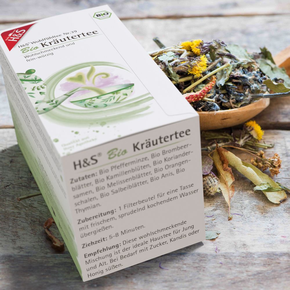 Boîte H&S Bio Kräutertee à côté d'un bol d'herbes.