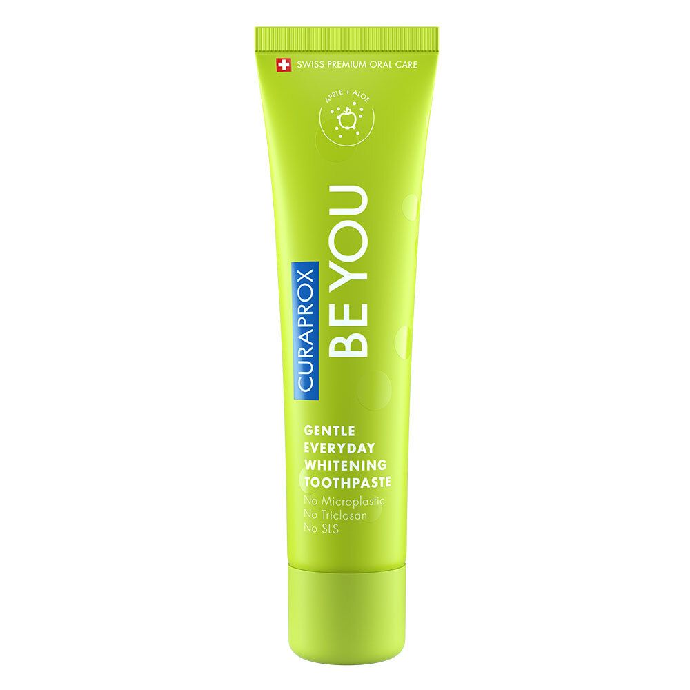 Tube de dentifrice vert. Inscription : BE YOU, CURAPROX, Gentle Everyday Whitening Toothpaste. Croix suisse. Design vert et blanc.