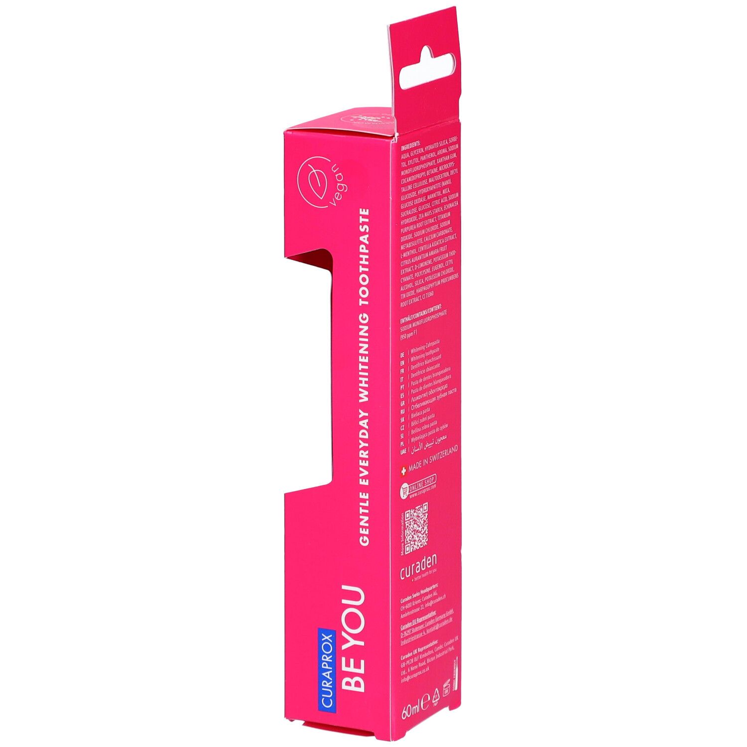 Emballage pour dentifrice blanchissant doux Curaprox BE YOU. Boîte rose avec texte et sceaux.