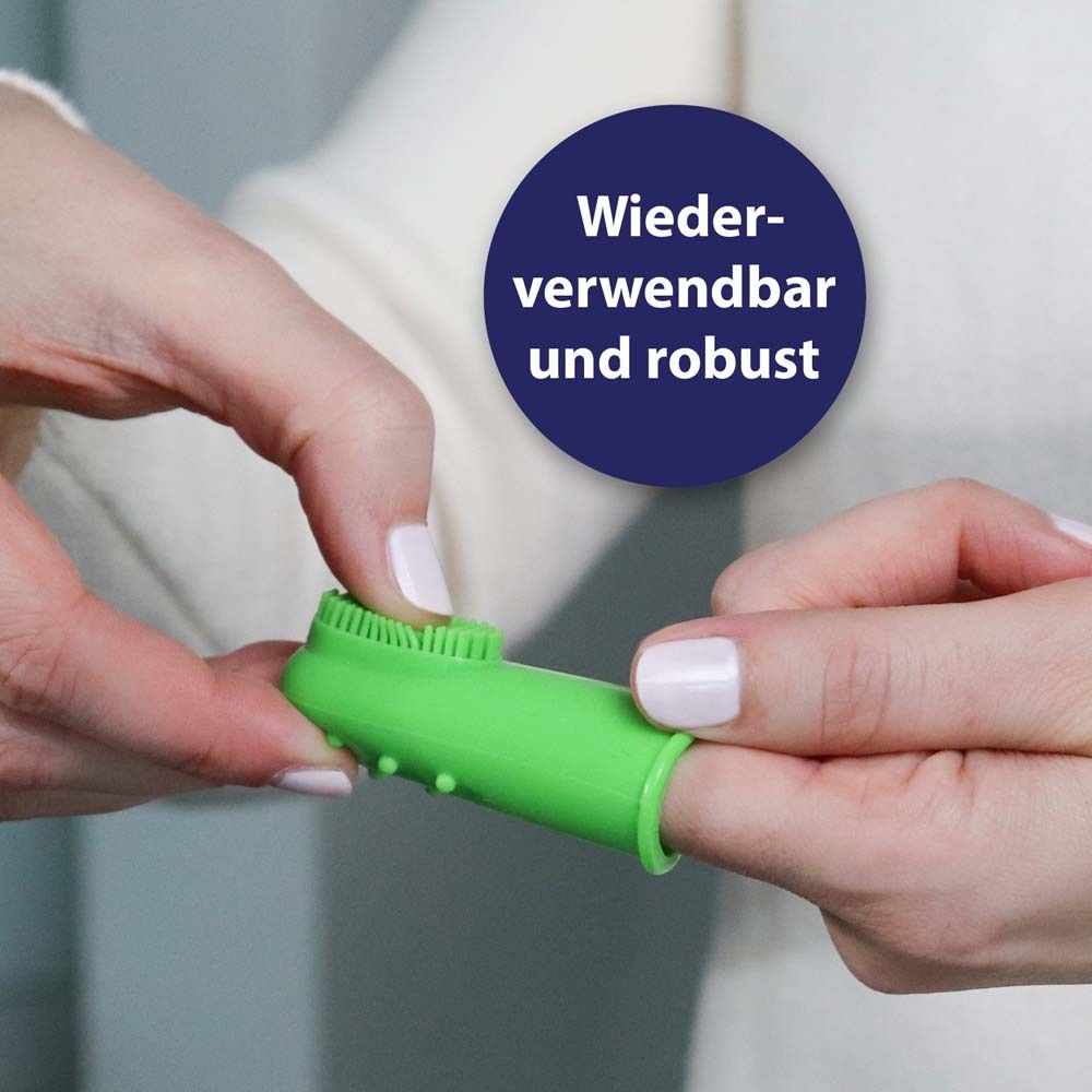 Embout de brosse à dents vert en forme de doigt avec picots et poils.