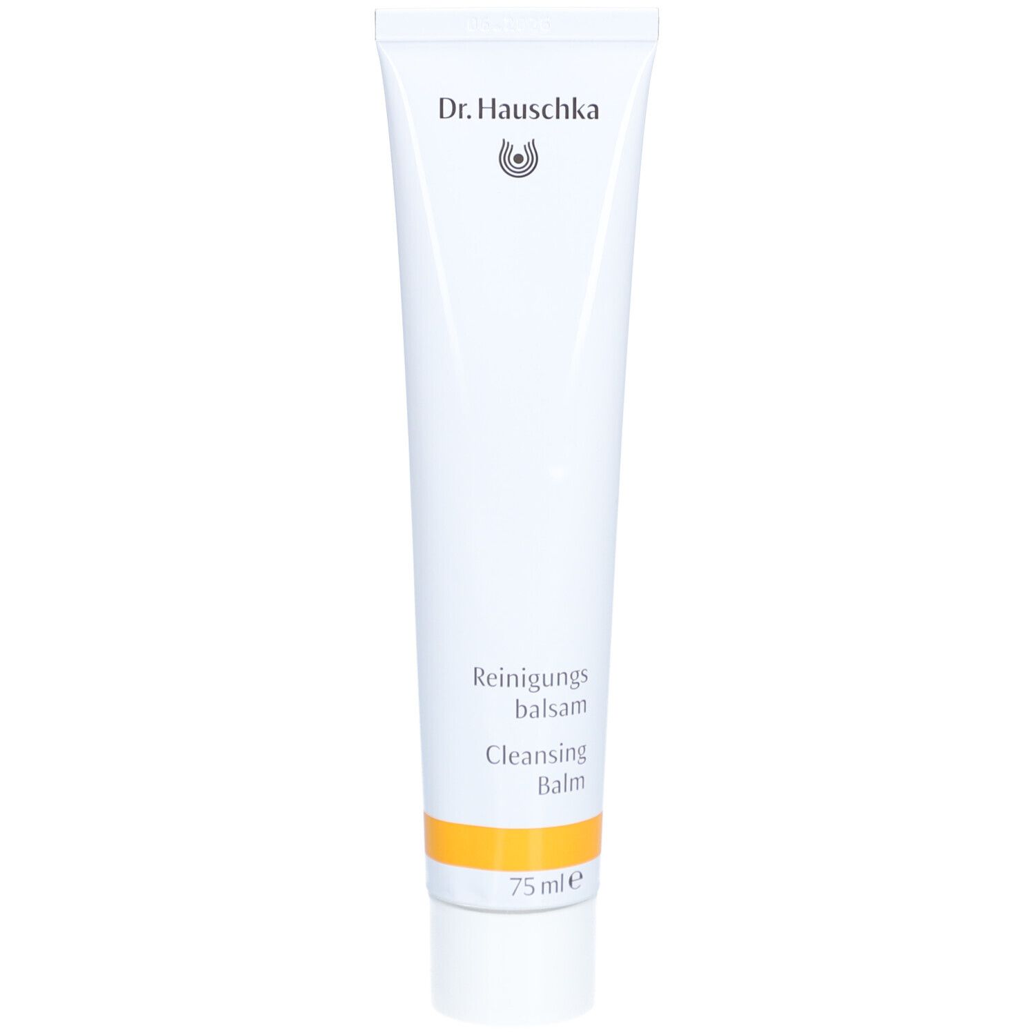 Tube blanche avec bande jaune. Inscription: Dr. Hauschka, Reinigungsbalsam, Cleansing Balm. 75 ml.
